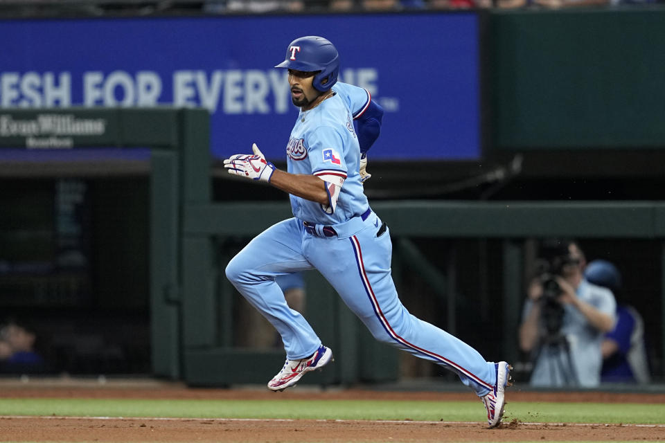 Texas Rangers' Marcus Semien heads to second base after hitting a leadoff double in the first inning of a baseball game against the Seattle Mariners, Sunday, June 4, 2023, in Arlington, Texas. (AP Photo/Tony Gutierrez)