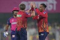 Punjab Kings' players celebrate the wicket of Rajasthan Royals' Dhruv Jurel during the Indian Premier League cricket match between Rajasthan Royals and Punjab Kings in Guwahati, India, Wednesday, May. 15, 2023. (AP Photo/Anupam Nath)