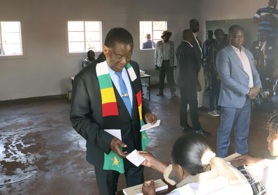 Zimbabwean President Emmerson Mnangagwa attends a polling station to cast his vote, in Kwekwe, Zimbabwe, Wednesday, Aug. 23, 2023. Polls have opened in Zimbabwe as President Emmerson Mnangagwa seeks a second and final term in a country with a history of violent and disputed votes. (AP Photo)