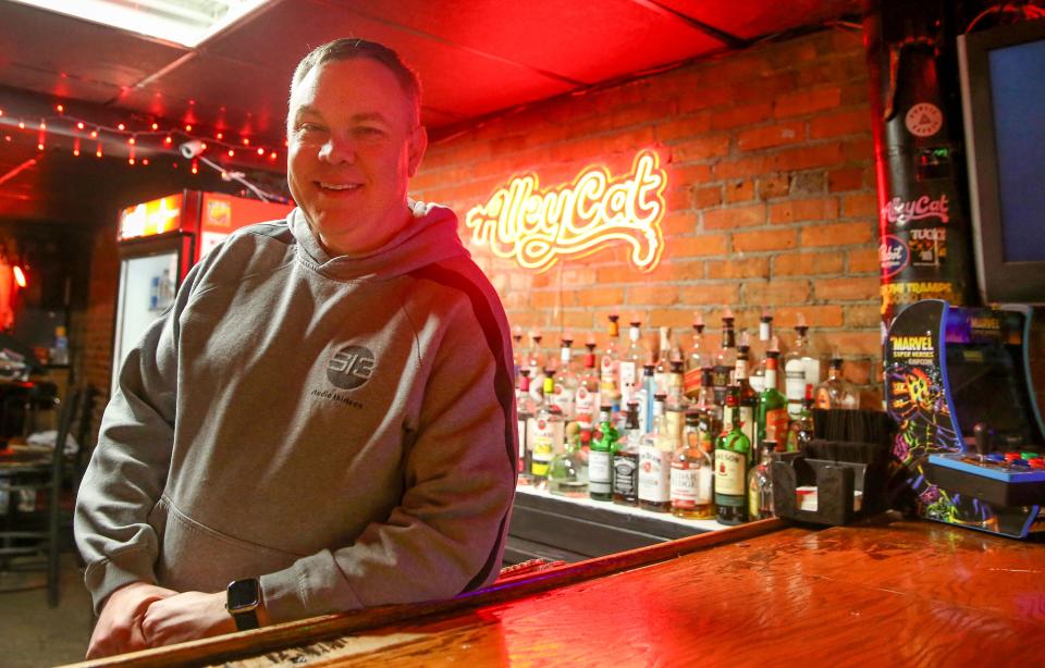 Jason Zeman, CEO of Corridor Entertainment Group, is pictured behind Alleycat's downstairs bar Tuesday, April 23, 2024 in downtown Iowa City, Iowa.