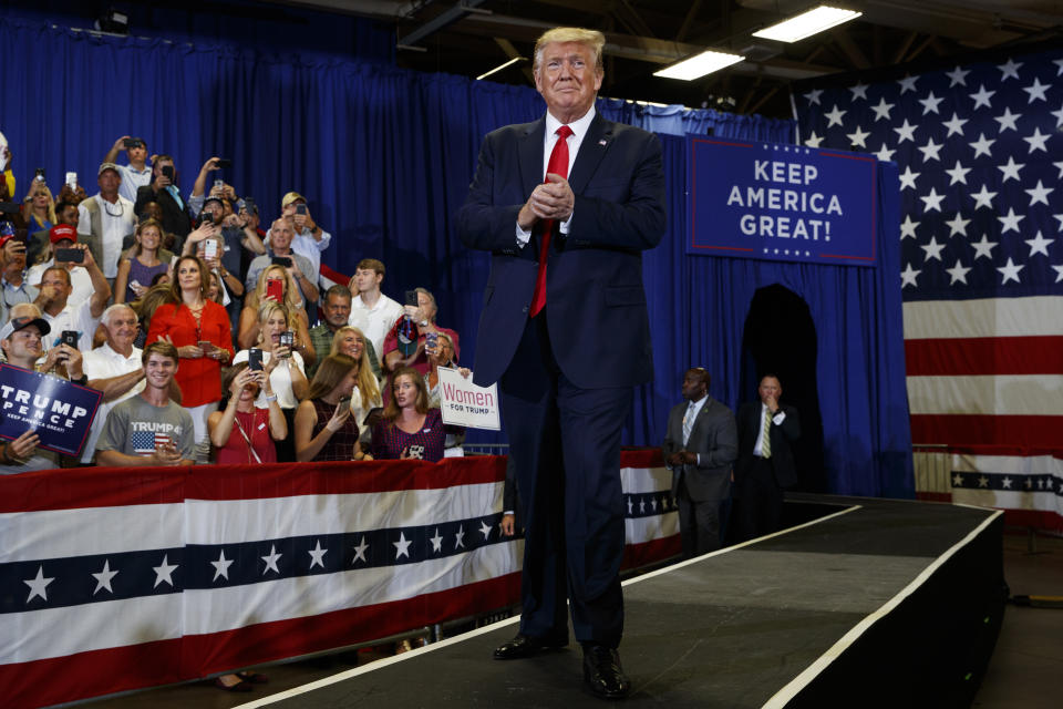 President Donald Trump arrives on stage at the Crown Expo for a campaign rally, Monday, Sept. 9, 2019, in Fayetteville, N.C. (AP Photo/Evan Vucci)