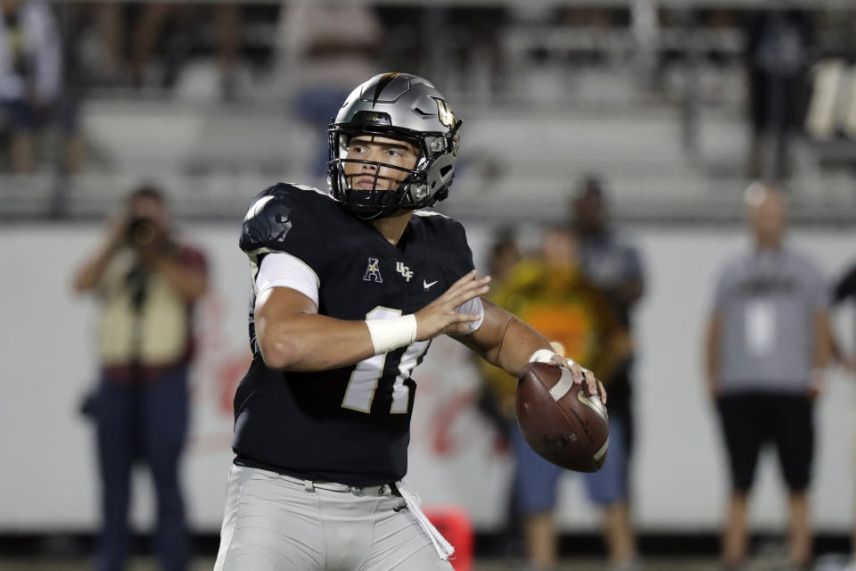 Central Florida quarterback Dillon Gabriel throws a pass during the second half of an NCAA college football game against East Carolina, Saturday, Oct. 19, 2019, in Orlando, Fla. (AP Photo/John Raoux)