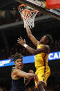 Minnesota forward Joshua Ola-Joseph (1) shoots over Michigan forward Terrance Williams II (5) during the first half of an NCAA college basketball game Thursday, Dec. 8, 2022, in Minneapolis. (AP Photo/Bruce Kluckhohn)