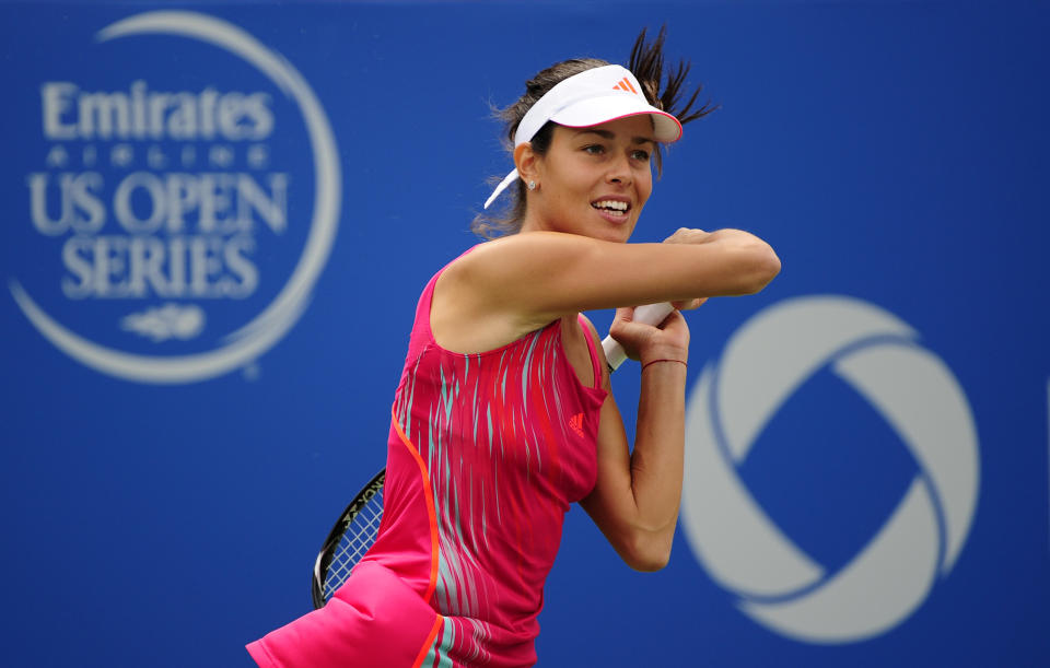 MONTREAL - AUGUST 9: Ana Ivanovic of Serbia returns the ball to Roberta Vinci of Italy during round two of the Rogers Cup at the Uniprix Stadium on August 9, 2012 in Montreal, Quebec, Canada. (Photo by Robert Laberge/Getty Images)