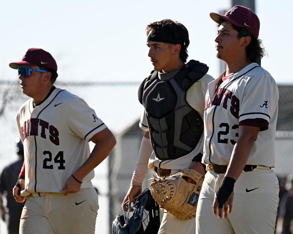 Adelanto's Zachary Viramontes, Daniel Fernandez, and Chris Espinoza walk back to the dugout after fending off Silverado in the seventh inning for the win on Thursday, April 11, 2024 in Adelanto. Adelanto defeated Silverado 5-3.