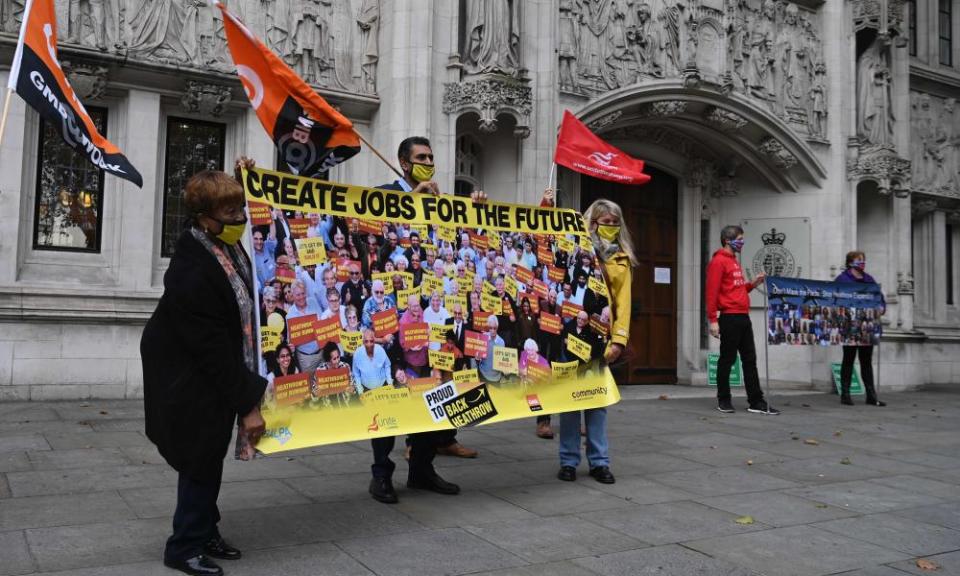 Protesters unfurl a banner outside the supreme court in London in support of Heathrow expansion