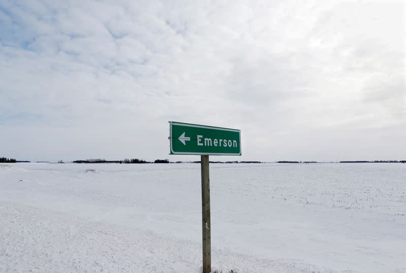 FILE PHOTO: A sign post for the small border town of Emerson, near the Canada-U.S border crossing