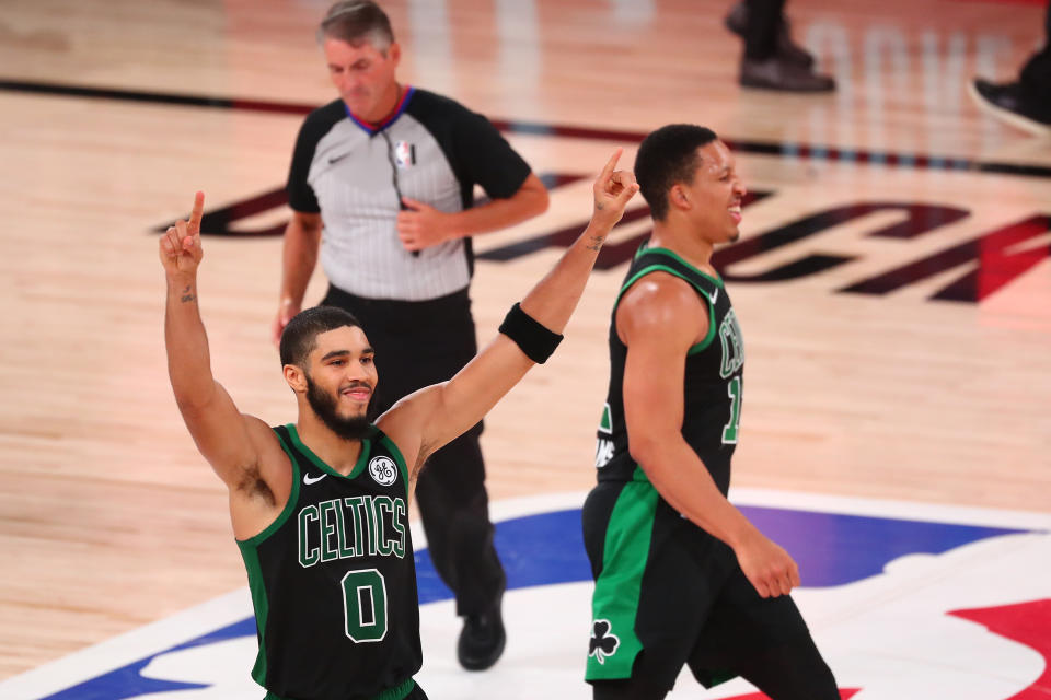 Sept. 11, 2020; Lake Buena Vista, Florida; Boston Celtics forward Jayson Tatum (0) celebrates with forward Grant Williams (right) after defeating the Toronto Raptors in Game 7 of the second round of the 2020 NBA playoffs at ESPN Wide World of Sports Complex. Kim Klement-USA TODAY Sports