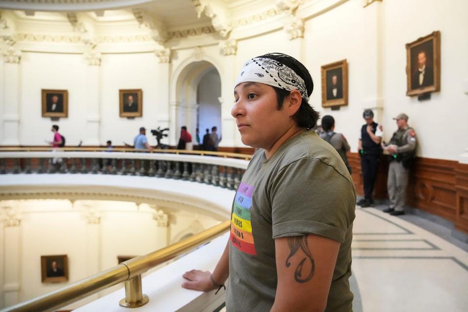 Gen Peña of Veterans for Equality stands in the Capitol Rotunda to keep watch for anti-LGBTQ+ counterprotesters Friday. Veterans for Equality aims to keep the peace and look out for LGBTQ+ activists.
