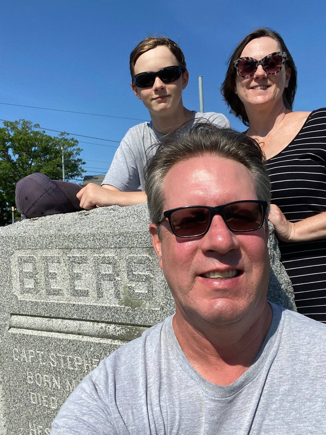 Josh Shaffer with his son, Sam, and his wife, Amber Nimocks. They’re at the grave of Capt. Beers in Delaware.