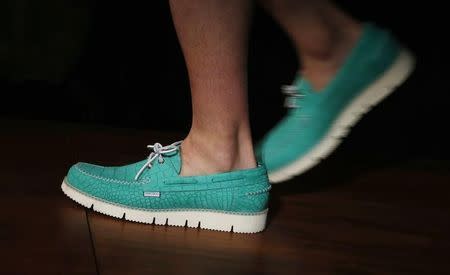 A model presents a creation from Jimmy Choo during its London Collections: Men show in London June 16, 2014. REUTERS/Suzanne Plunkett