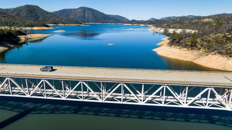 A car crosses Enterprise Bridge over Lake Oroville on March 26, 2023, in Butte County, California. 