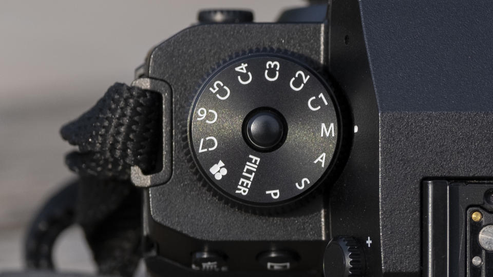 The Fujifilm X-H2S camera sitting on a wooden bench