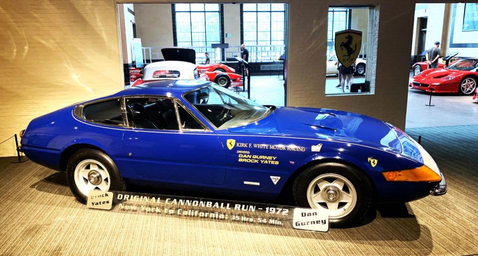 a blue car in a showroom