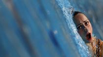 Ukraine's Anna Voloshina performs in the synchronised swimming solo free routine preliminaries during the European Swimming Championships in Berlin in this August 15, 2014 file photo. REUTERS/Michael Dalder/Files (GERMANY - Tags: SPORT SWIMMING TPX IMAGES OF THE DAY)