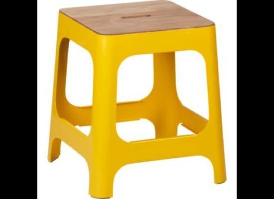 Not only does a bright <a href="http://www.cb2.com/color/trends/hitch-marigold-stool/f7168" target="_hplink">marigold stool</a> offer extra seating, it can double as a small bed side table to liven up a room without looking too flashy.