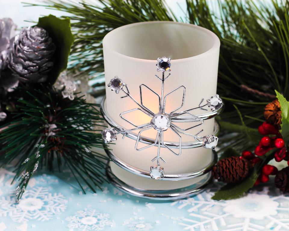 This undated product image provided by Beau-coup.com shows a snowflake votive, an attractive, useful gift to give as a party favor for a holiday celebration. (AP Photo/Beau-coup.com)