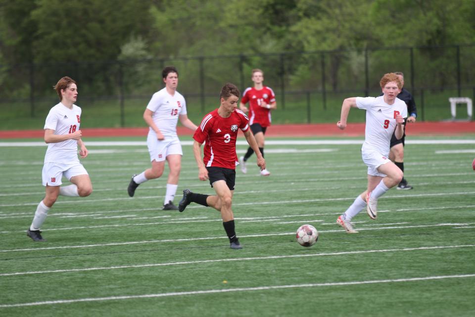 ADM's Tom Hook (3) sprints by a trio of Boone defenders on Thursday, May 2, 2024.