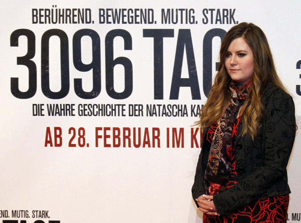 Austrian Natascha Kampusch poses for photographers before the premiere of the film "3096 Days" in Vienna, Austria, Monday Feb. 25, 2013. The film tells the story of Kampusch who was abducted as a schoolgirl and held prisoner in a cellar for almost nine years. (AP Photo/Ronald Zak)