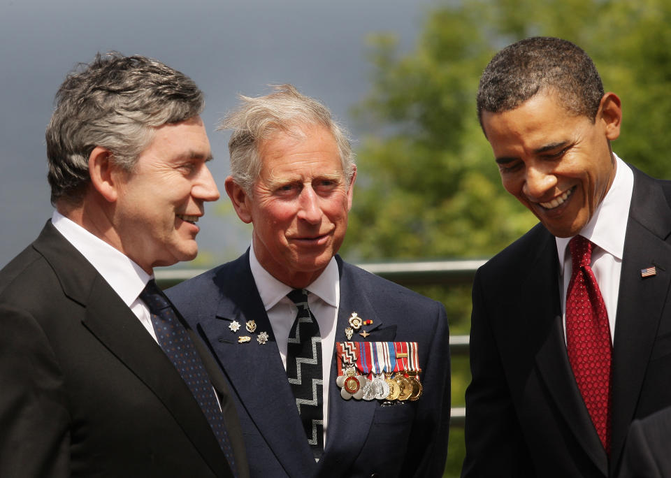 British  Prime Minister Gordon Brown (L) talks with U.S. President Barack Obama (R) as Prince Charles, The Prince of Wales looks on at the Normandy American Cemetery on June 6, 2009 in Colleville-sur-Mer, France. Political leaders and veterans are attending this international ceremony to commemorate the 65th anniversary of the D-Day landings on June 6, 1944.  (Getty Images)