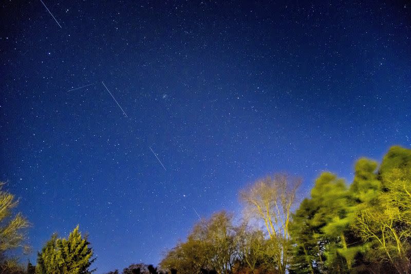 FILE PHOTO: SpaceX Starlink 5 satellites are pictured in the sky seen from Svendborg