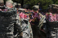 <p>U.S. Army soldiers of the 3rd United States Infantry Regiment arrive with sacks of U.S. flags to place on Arlington National Cemetery graves in advance of Memorial Day in Arlington, Va., May 24, 2018. (Photo: Jonathan Ernst/Reuters) </p>