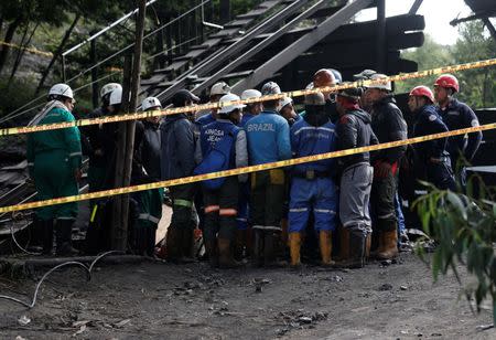 Rescue personnel coordinate to search for missing miners after an explosion at an underground coal mine on Friday, in Cucunuba, Colombia June 24, 2017. REUTERS/Jaime Saldarriaga