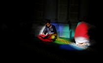 <p>A Palestinian man reads verses of the Quran, Islam’s holy book, during the month of Ramadan at al-Omari mosque in Gaza City, Monday, May 29, 2017. (AP Photo/Hatem Moussa) </p>