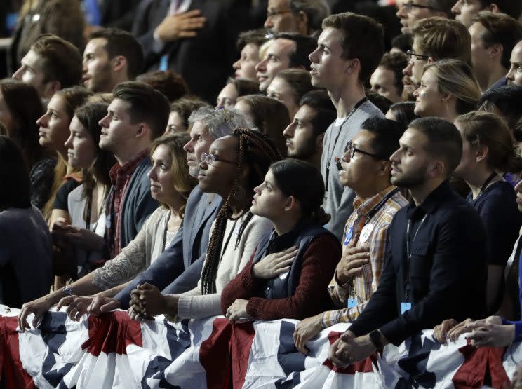 Guests recite the Pledge of Allegiance during Hillary Clinton's election night rally in the Jacob Javits Center in New York. (Photo: David Goldman/AP)