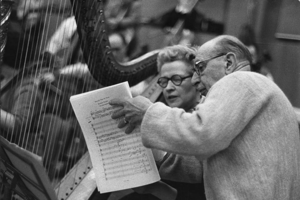 Russian-born composer Igor Stravinsky studying a score with Sidonie Goossens with the BBC Symphony Orchestra at BBC Maida Vale Studio (Getty Images)