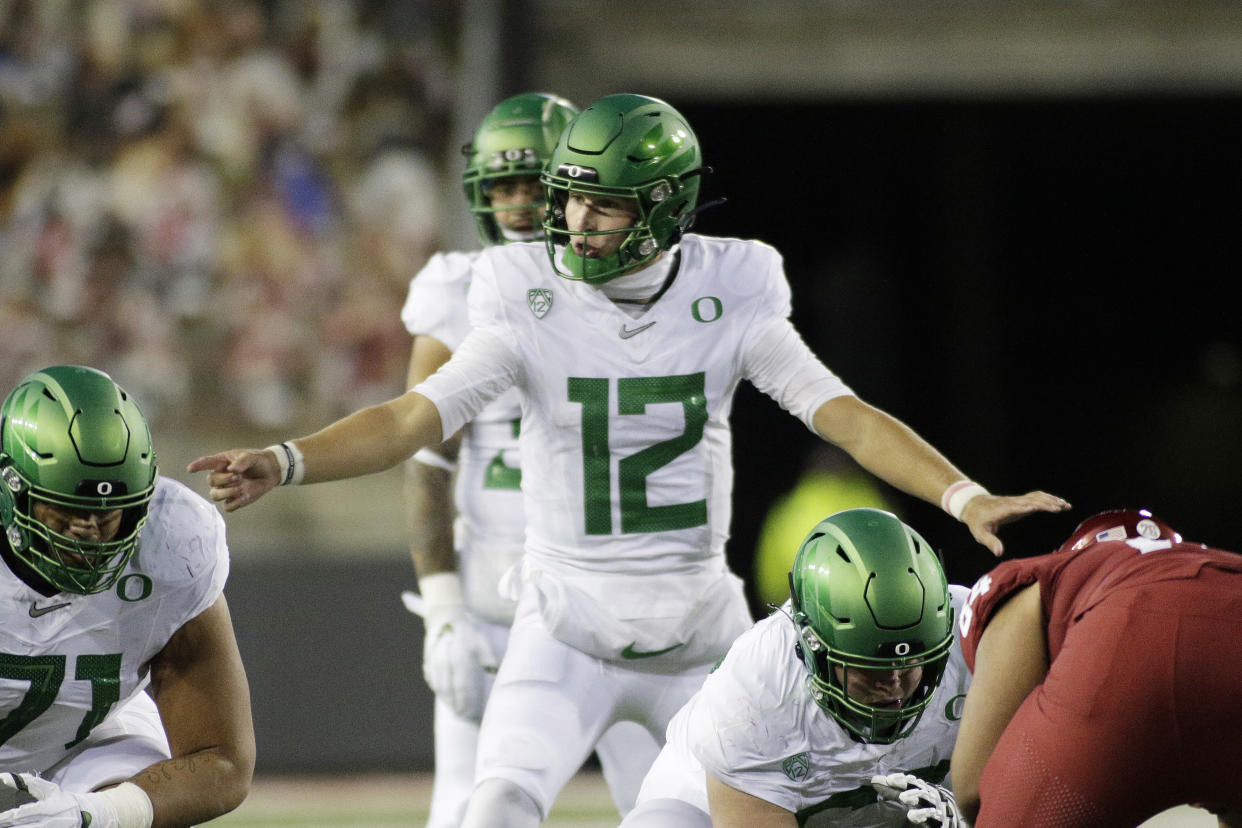 Oregon quarterback Tyler Shough (12) calls a play during the second half of an NCAA college football game against Washington State in Pullman, Wash., Saturday, Nov. 14, 2020. Oregon won 43-29. (AP Photo/Young Kwak)