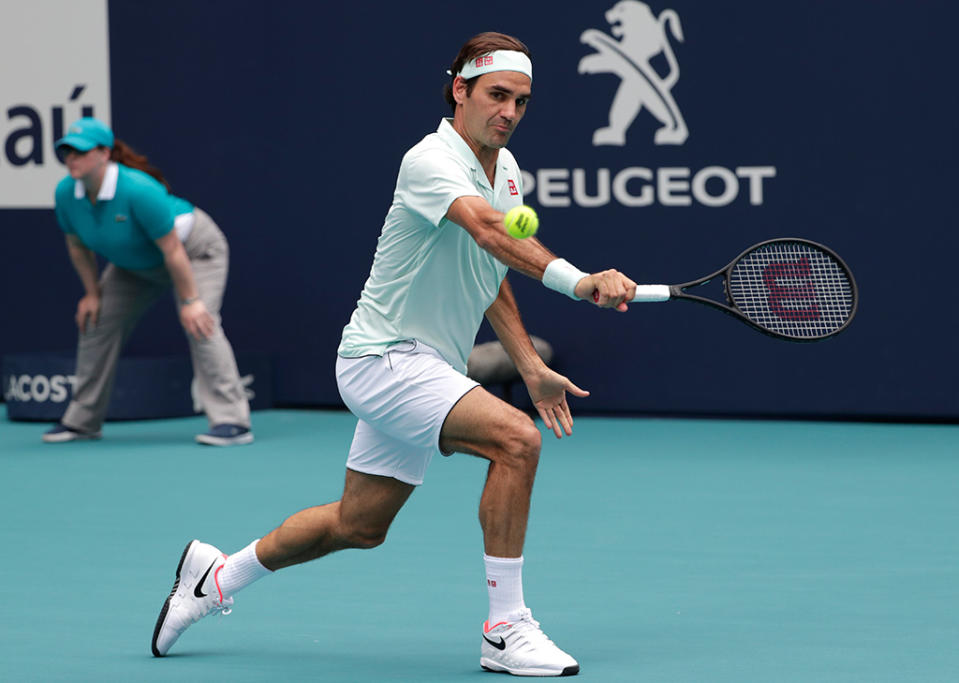 Roger Federer, of Switzerland, returns to John Isner during the singles final of the Miami Open tennis tournament, in Miami Gardens, FlaMiami Open Tennis, Miami Gardens, USA - 31 Mar 2019