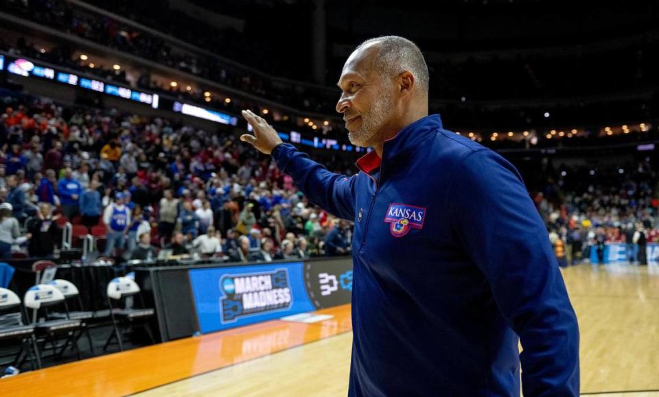 Acting Kansas head coach Norm Roberts salutes the crowd as he walks off the court after defeating Howard 98-68 in a first-round college basketball game against Howard in the NCAA Tournament Thursday, March 16, 2023, in Des Moines, Iowa.