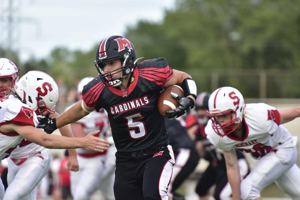 Cardinal Mooney's Brendan Haisenleder carries the ball during a game earlier this season. The senior ran for 2,302 yards and 28 touchdowns in 2022, both of which were school records.