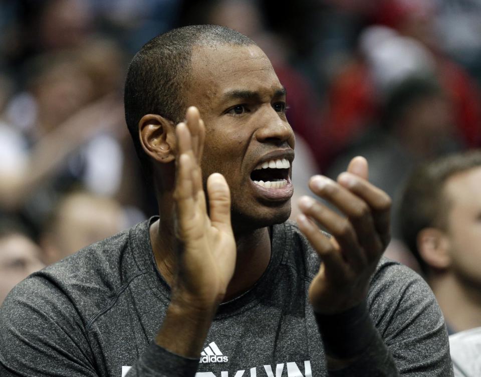 Brooklyn Nets' Jason Collins reacts from the bench in the second half of an NBA basketball game against the Milwaukee Bucks Saturday, March 1, 2014, in Milwaukee. (AP Photo/Jeffrey Phelps)