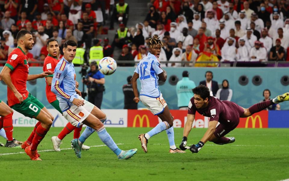 Morocco's Yassine Bounou makes a save as Spain's Alvaro Morata - REUTERS