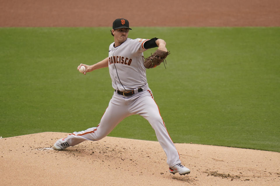 San Francisco Giants starting pitcher Kevin Gausman works against a San Diego Padres batter during the first inning of a baseball game Sunday, May 2, 2021, in San Diego. (AP Photo/Gregory Bull)