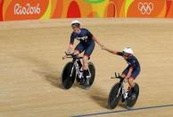 2016 Rio Olympics - Cycling Track - Preliminary - Women's Team Pursuit Qualifying - Rio Olympic Velodrome - Rio de Janeiro, Brazil - 11/08/2016. Laura Trott (GBR) of Great Britain and Kate Archibald (GBR) of Great Britain celebrate setting a world record. REUTERS/Matthew Childs