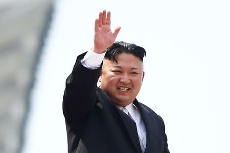 FILE PHOTO: North Korean leader Kim Jong Un waves to people attending a military parade marking the 105th birth anniversary of country's founding father, Kim Il Sung in Pyongyang, April 15, 2017. REUTERS/Damir Sagolj/File Photo