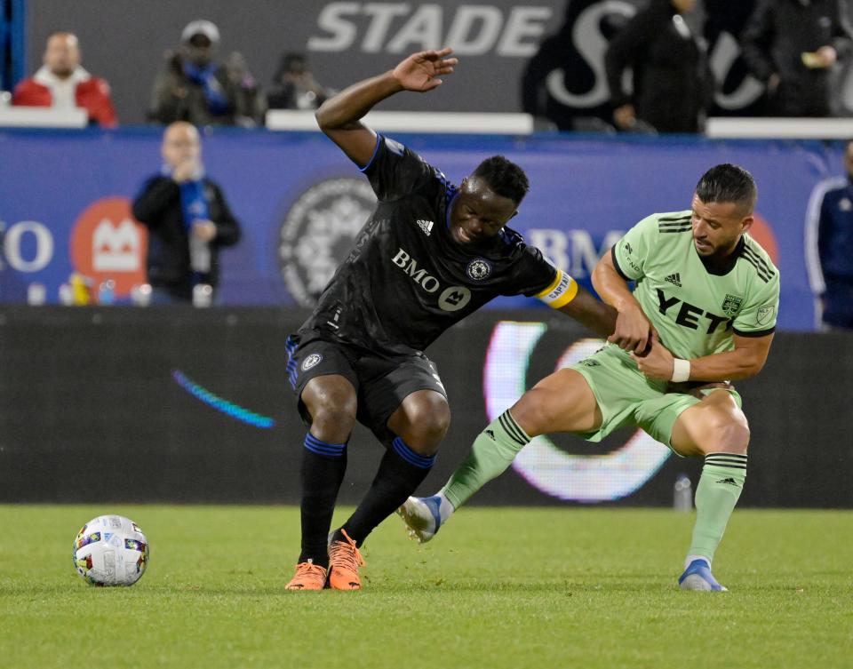 Austin FC midfielder Felipe Martins, right, pulls on the arm of CF Montreal midfielder Victor Wanyama during the second half of Saturday night's 1-0 win. Austin FC returns home for a match against Dallas on Saturday.