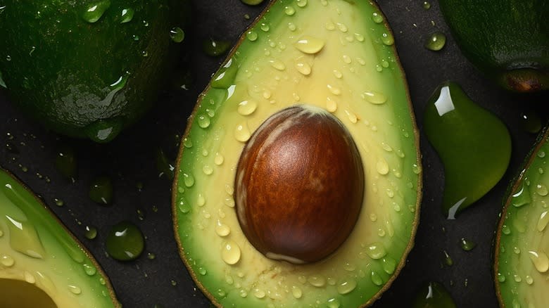 fresh avocados with water droplets 
