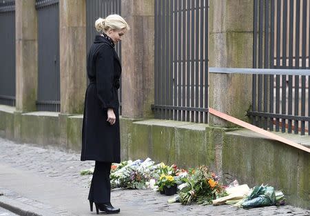 Denmark's Prime Minister Helle Thorning-Schmidt places flowers in front of the synagogue in Krystalgade in Copenhagen, February 15, 2015. REUTERS/Fabian Bimmer
