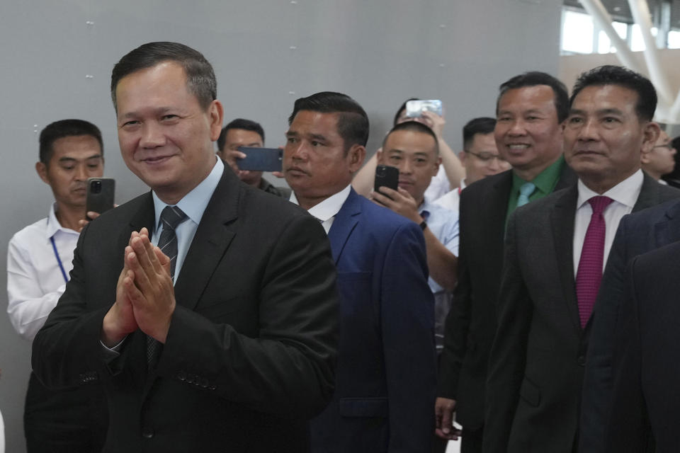 Cambodian Prime Minister Hun Manet, front left, arrives to lead an inauguration ceremony of Cambodia’s newest and biggest airport, Siem Reap Angkor International Airport in Siem Reap province, Cambodia, Thursday, Nov. 16, 2023. The new airport can handle 7 million passengers a year, with plans to augment it to handle 12 million passengers annually from 2040. It was constructed under a 55-year build-operate-transfer (BOT) program between Cambodia and China. (AP Photo/Heng Sinith)