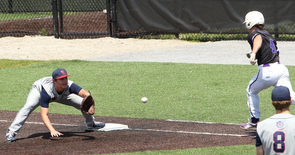 Bedford North Lawrence's Kaedyn Bennett (22) gets the out as Seymour's Charlie Longmeier (4) runs to first base during the sectional semi-final game with Seymour on Saturday, May 28, 2022 at Jennings County.