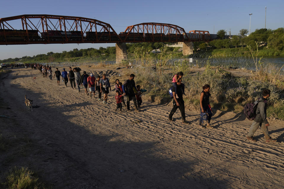 Migrants who crossed the Rio Grande and entered the U.S. from Mexico are moved for processing by U.S. Customs and Border Protection, Saturday, Sept. 23, 2023, in Eagle Pass, Texas. (AP Photo/Eric Gay)
