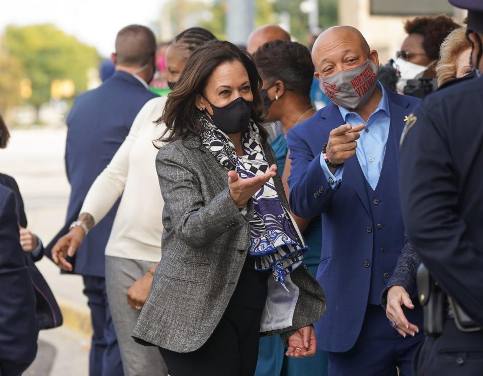 U.S. Senator and Democratic Vice Presidential nominee Kamala Harris talks with Flint Mayor Sheldon Neeley in downtown Flint on September 22, 2020, during a campaign stop in Michigan.