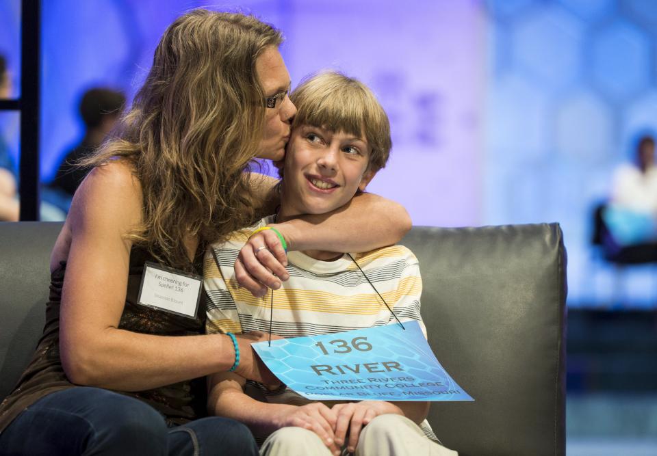 River Blount of Poplar Bluff, Missouri, receives a kiss from his mother Shannon after he failed to spell "fauces" during the semi-final round of the 88th annual Scripps National Spelling Bee at National Harbor, Maryland May 28, 2015. REUTERS/Joshua Roberts