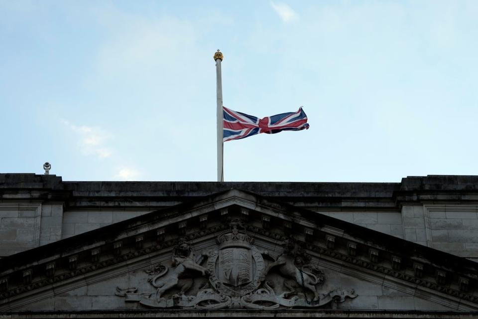 The union jack that flies over Buckingham Palace in London is lowered after the death of Queen Elizabeth II (AP)