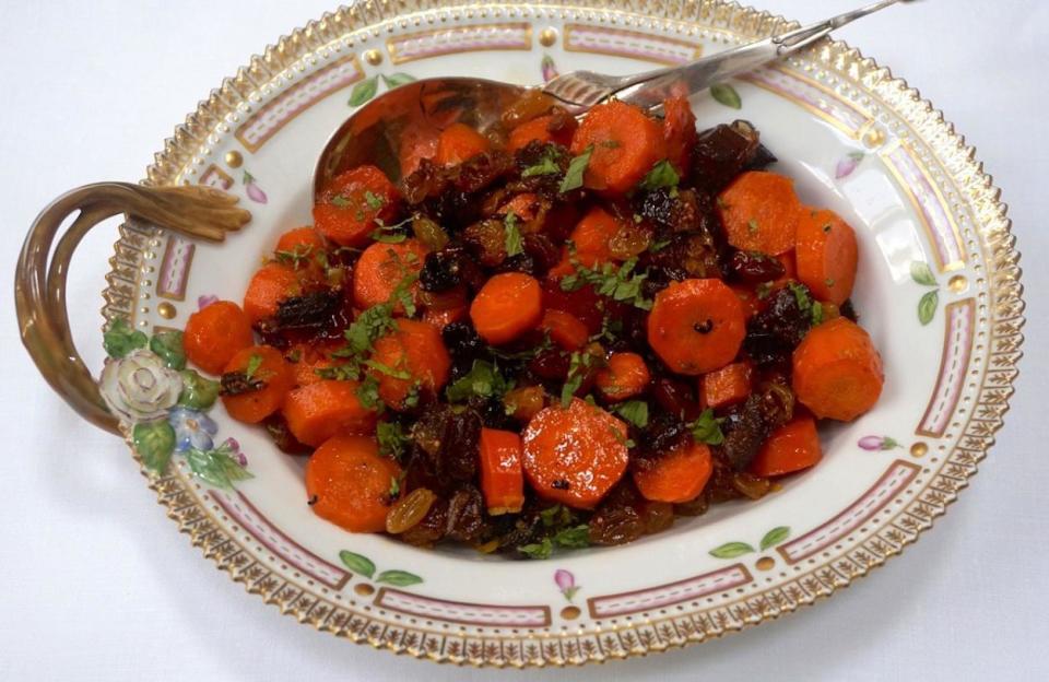 <p>Tzimmes is most closely associated with Rosh Hashanah, but it’s an all-around holiday favorite. It’s made by slowly stewing carrots with dried fruits like dates and raisins; other root vegetables like yams are also common. They’re cooked down with honey and spices until tender and sticky with glaze. </p> <p><a href="https://www.thedailymeal.com/best-recipes/tzimmes-recipe?referrer=yahoo&category=beauty_food&include_utm=1&utm_medium=referral&utm_source=yahoo&utm_campaign=feed" rel="nofollow noopener" target="_blank" data-ylk="slk:For the Tzimmes recipe, click here.;elm:context_link;itc:0;sec:content-canvas" class="link ">For the Tzimmes recipe, click here.</a></p>