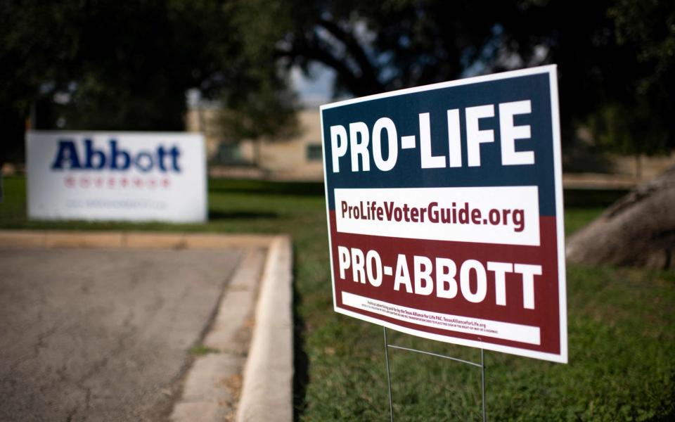 A Texas Governor Greg Abbott sign - AFP